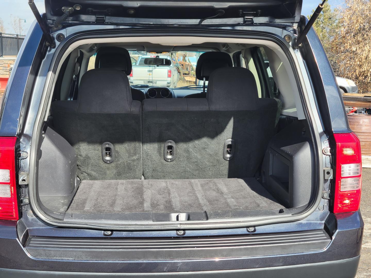 2014 Blue /Black Jeep Patriot Latittude (1C4NJRFB7ED) with an 2.4L I4 engine, 6 Speed Automatic transmission, located at 450 N Russell, Missoula, MT, 59801, (406) 543-6600, 46.874496, -114.017433 - Photo#6
